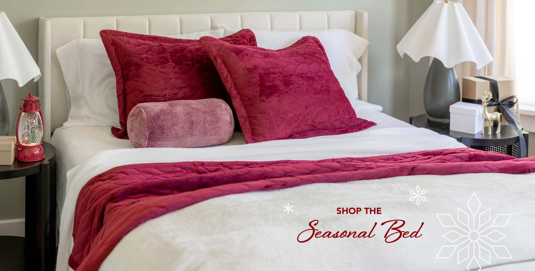 Shop the Seasonal Bed. Image of a bed styled with red and white products with holiday styling