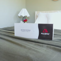 Video of a Polartec Softec Microfleece Blanket in a box and dressed on a bed in a bright room.