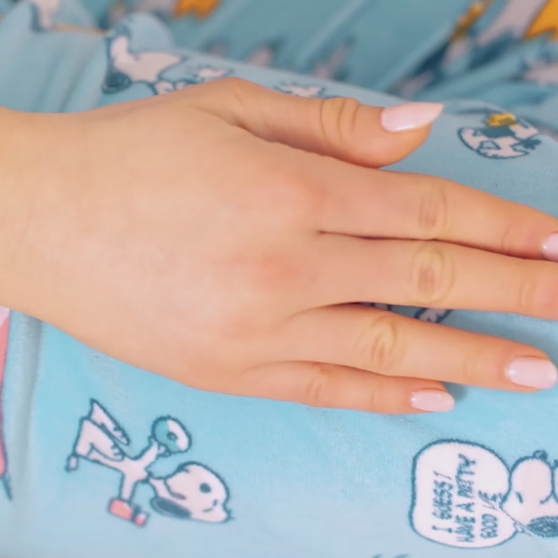 Video of Peanuts fleece lounge pants worn by models.